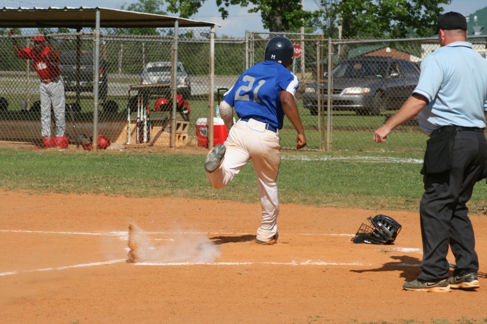 OF, Keon Rucker crossing home. 